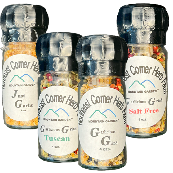 Assorted Mountain Comer Herb Farm spice grinders.